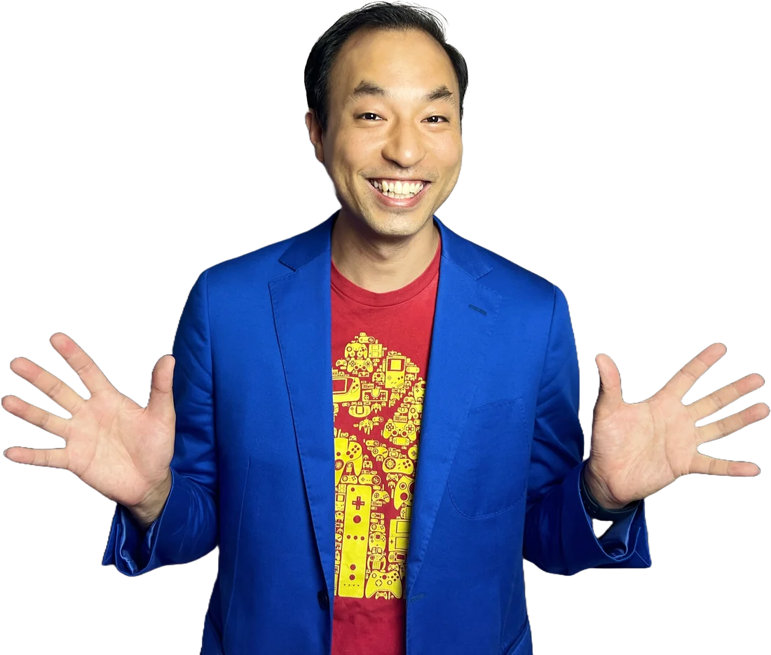 Magic Dave, David Ung, smiling with hands raised mid-show